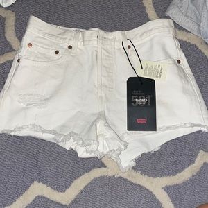 Levi’s white 501 mid rise jean shorts